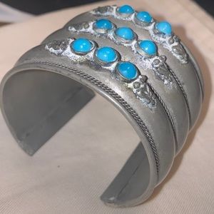 Pewter blue plastic bracelet cuff 
Measures 7” long x 2” thick